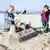 Picture of two children building a sandcastle on a beach