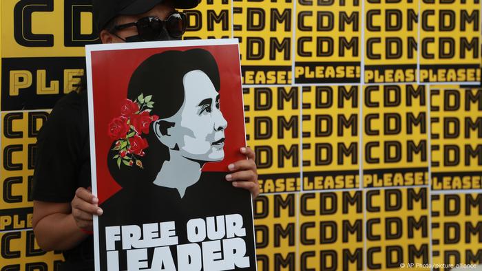  Myanmar Protesters hold placards with images of ousted leader Aung San Suu Kyi last month/