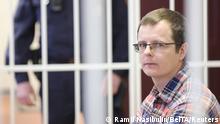 Doctor Artyom Sorokin sits inside a defendants' cage during a court hearing in Minsk, Belarus February 19, 2021. Katerina Borisevich, a journalist for online news portal Tut.by, and doctor Artyom Sorokin were detained for the disclosure of medical secrets, which entailed grave consequences after the publication of the medical records of a 31-year-old anti-government protester who was killed after what protesters say was a severe beating by security forces. Ramil Nasibulin/BelTA/Handout via REUTERS ATTENTION EDITORS - THIS IMAGE HAS BEEN SUPPLIED BY A THIRD PARTY. NO RESALES. NO ARCHIVES. MANDATORY CREDIT.