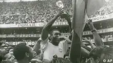 Brazil's Pele (Edson Arantes do Nascimento) has a big smile as he holds the Jules Rimet Trophy, following Brazil's 4-1 victory over Italy in the World Cup finals at the Azteca Stadium in Mexico City, Mexico on June 21, 1970. (AP Photo/STF)