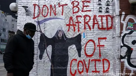 A mural depicting US President Donald Trump as the Grim Reaper on a wall.