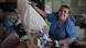 A woman empties a bag of garbage in Costa Rica A woman empties a bag of garbage in Costa Rica
