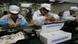 Workers on the production line at the Foxconn complex in the southern Chinese city of Shenzhen Workers on the production line at the Foxconn complex in the southern Chinese city of Shenzhen