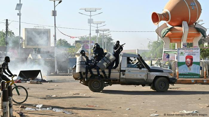 Nigerien police on a pick-up truck during a protest.