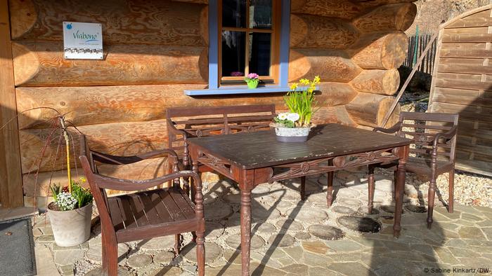 Germany corona pandemic |  Table with three chairs in front of a holiday home in the Eifel village of Gemünd