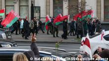 MINSK, BELARUS - OCTOBER 19, 2020: Supporters of Belarus' President Alexander Lukashenko (back) and Belarusian opposition activists during the March of Seniors in central Minsk. Natalia Fedosenko/TASS