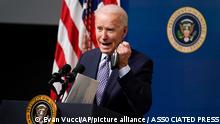 President Joe Biden holds his face mask as he speaks during an event to commemorate the 50 millionth COVID-19 shot, in the South Court Auditorium on the White House campus, Thursday, Feb. 25, 2021, in Washington. (AP Photo/Evan Vucci)