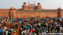 26.01.21 *** FILE PHOTO: Farmers gather in front of the historic Red Fort during a protest against farm laws introduced by the government, in Delhi, India, January 26, 2021. REUTERS/Adnan Abidi/File Photo