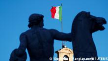 FILE PHOTO: An Italian flag flies over the Quirinale Palace in Rome, Italy, January 26, 2021. REUTERS/Guglielmo Mangiapane/File Photo