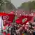 Protesters gather in the Tunisian capital Tunis waving national flags