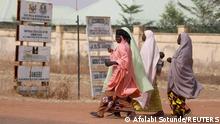 Women walk past the JSS Jangebe school in Zamfara, Nigeria February 27, 2021. REUTERS/Afolabi Sotunde