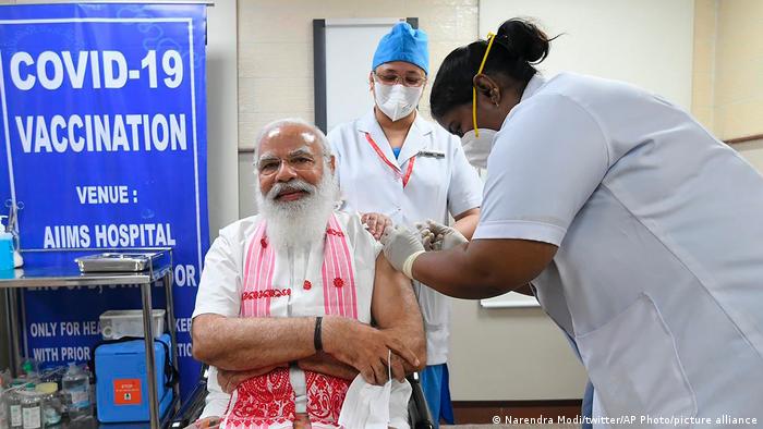 Narendra Modi receives a dose of coronavirus vaccine in New Delhi. 