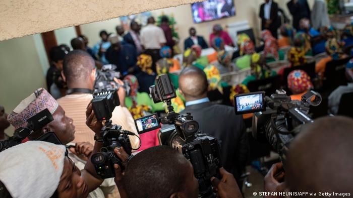 Journalists in Nigeria clamor during the release of the Chibok girls in Nigeria, 2017 