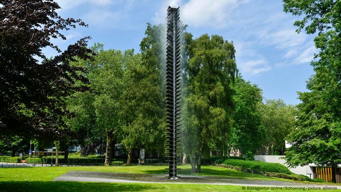 A stele from which water flows.  The sculpture Wasser-Plastik, 1977, is in the sculpture park in Münster.