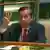 Myanmar's ambassador to the United Nations Kyaw Moe Tun holds up three fingers in solidarity with protesters at the end of his speech to the General Assembly.  