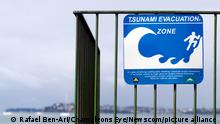 AUCKLAND,NZ - MAY 30:Tsunami evacuation route sign on May 30 2013.A seabed earthquake along numerous stretches of the NZ coast can put a 10m-high tsunami wave within minutes to reach the coast ashore. Photo via Newscom picture alliance