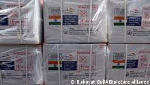 FILE - In this file photo dated Sunday, Feb. 7, 2021, Boxes of the first shipment of 500,000 doses of the AstraZeneca coronavirus vaccine made by Serum Institute of India, donated by the Indian government, await distribution at the customs area of the Hamid Karzai International Airport, in Kabul, Afghanistan. The World Health Organization Monday Feb. 15, 2021, granted an emergency authorization to the coronavirus vaccine made by AstraZeneca, a move that should allow its partners to ship millions of doses to countries worldwide as part of a U.N.-backed program to stop the pandemic. (AP Photo/Rahmat Gul, FILE)