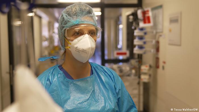Katrin Berger wears a face mask in the hospital