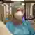 Katrin Berger wears a face mask in the hospital