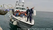 Refugees and migrants from Syrian, Afghanistan and Eritrea after trying to cross the sea from Turkey to Lesbos, at the port of Mytelene on March 17, 2016 in Mytelene, Greece. As many migrants intend to cross the sea between Turkey and Lesbos, the coast guards from Greece cruise around in order to stop the boats and embark the people to reach the Mitilini harbour. (Photo by Guillaume Pinon/NurPhoto)