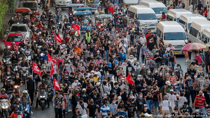 Anti-government protesters march to the criminal court during a protest in Bangkok, Thailand, Saturday, March 6