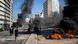 Protesters stand next to burning tires set on fire to block a main road in Beirut, Lebanon Protesters stand next to burning tires set on fire to block a main road in Beirut, Lebanon