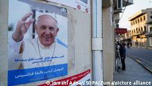 March 3, 2021, Mosul, Nineveh, Iraq: A poster of Pope Francis seen on a wall in the old market..Youth Iraqis launched a campaign to spread posters of Pope Francis in the streets of the old area of the city of Mosul, welcoming his visit to the city on the seventh of March 2021 during the historic visit to Iraq from 5 to 8 March. His historical visit includes a trip to several cities such as the capital Baghdad, the city of Mosul in north and a meeting with the Shiite religious authority Ayatollah Ali Sistani. (Credit Image: © Ismael Adnan/SOPA Images via ZUMA Wire