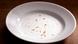 Crumbs on a white plate Crumbs on a white plate