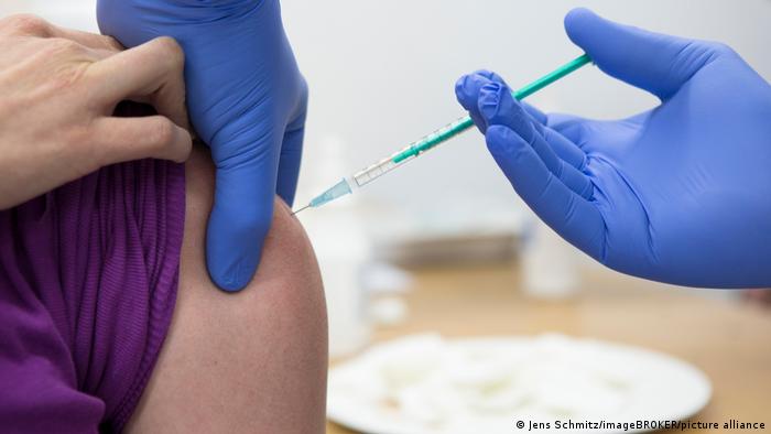 A person being vaccinated in the arm