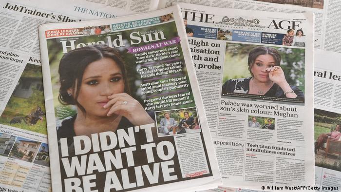  Several newspapers with pictures of Meghan