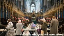 People arrive to receive their COVID-19 vaccine, at a new vaccination site, at Poets' Corner in Westminster Abbey, London, Wednesday March 10, 2021. (Stefan Rousseau/PA via AP)