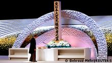 Japan's Prime Minister Yoshihide Suga bows in front of the altar for victims of the March 11 earthquake and tsunami at the national memorial service on the 10th anniversary of the disaster, in Tokyo, Japan March 11, 2021. Behrouz Mehri/Pool via REUTERS