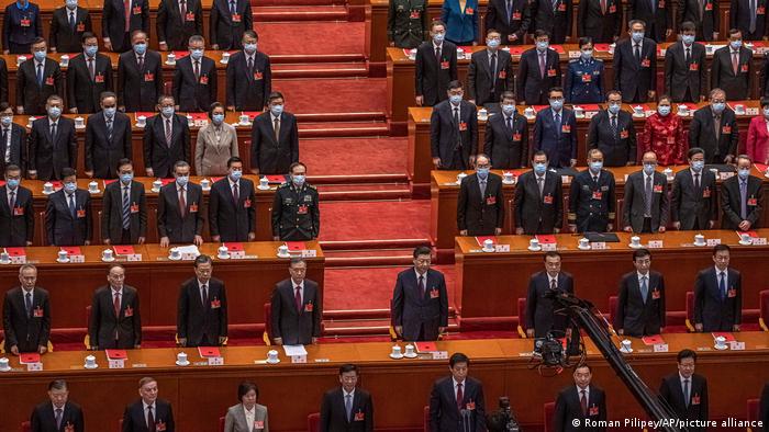 Chinese President Xi Jinping, top center, and Premier Li Keqiang, top center right, with other delegates during the closing session of the National People's Congress (NPC)