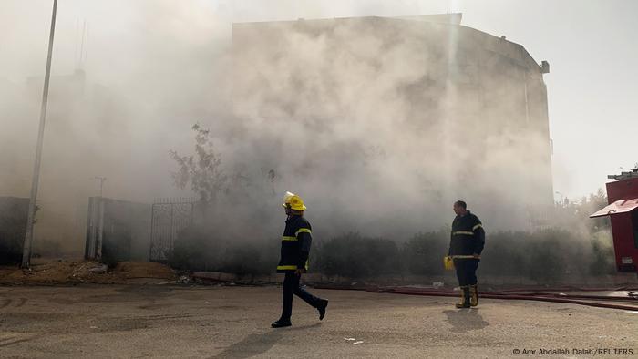  Firefighters are seen at the scene after a fire broke out in a garment factory north of Cairo, Egypt