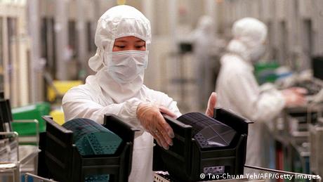 A picture showing a TSMC technicians working at a plant in the Hsinchu Science Industrial Park in Taiwan