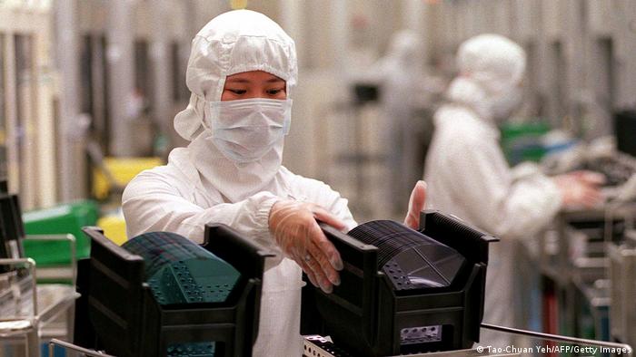 A TSMC technician at work in a factory at the Hsinchu Industrial Park in Taiwan