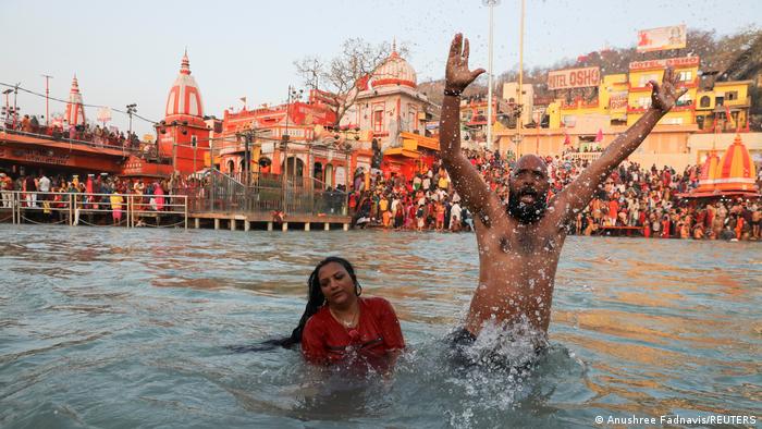 Devotees bathe in the Ganges River during the first auspicious bathing day at the Kumbh Mela festival in Haridwar