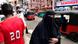 A Muslim woman in Sri Lanka is seen wearing a religious garment that leavers only her eyes and hands visible A Muslim woman in Sri Lanka is seen wearing a religious garment that leavers only her eyes and hands visible
