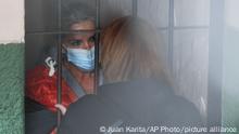 13.03.2021
Standing behind bars, Bolivia's former interim President Jeanine Anez speaks to an unidentified woman at a police station jailhouse, in La Paz, Bolivia, Saturday, March 13, 2021. The conservative interim president who led Bolivia for a year was arrested Saturday as officials of the restored leftist government pursue those involved in the 2019 ouster of socialist leader Evo Morales, which they regard as a coup, and the administration that followed. (AP Photo/Juan Karita)