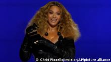 Beyonce accepts the award for best R