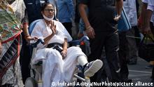 West Bengal chief minister Mamata Banerjee attends a rally of Trinamool Congress on a wheel chair as she was injured on her leg, before West Bengal assembly election in Kolkata, India, 14 March, 2021. (Photo by Indranil Aditya/NurPhoto)