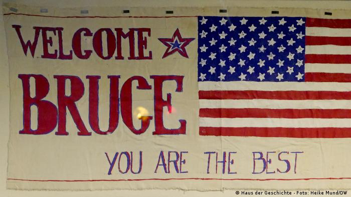 A US flag reads Welcome Bruce, you are the best
