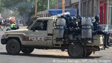 Riot police officers patrol on a pick-up truck during clashes with demonstrators as opposition supporters protest after the announcement of the results of the country's presidential run-off in Niamey, on February 24, 2021. - Opposition leader Mahamane Ousmane on February 24 claimed he narrowly won Niger's presidential elections, a day after official results said he lost by more than 11 percentage points. (Photo by Issouf SANOGO / AFP) (Photo by ISSOUF SANOGO/AFP via Getty Images)