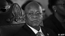 (FILES) In this file photo taken on July 29, 2020 Tanzanian President John Magufuli attends the burial ceremony of the former Tanzanian President Benjamin Mkapa has died age 81 at Mkapa’s home village in Lupaso, southern Tanzania. - Tanzanian President John Magufuli has died from a heart condition, his vice president said in an address on state television on March 17, 2021,, after days of uncertainty over his health and whereabouts. (Photo by STR / AFP)