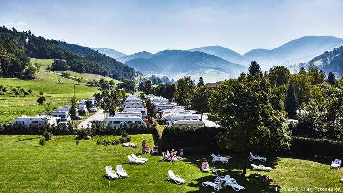 Germany, Aerial view of the Munstertal campsite with the Alps in the background