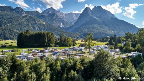 Germany, a campsite surrounded by meadows,trees and the Alps including the Zugspitze 