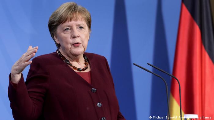 German Chancellor Angela Merkel speaks during a press conference in Berlin on Friday