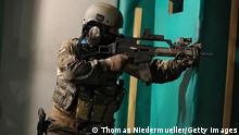 CALW, GERMANY - JULY 14: Troops of the elite KSK unit demonstrate their skills at a Bundeswehr base during the visit of German Defense Minister Ursula von der Leyen on July 14, 2014 in Calw, Germany. The KSK, which stands for Kommando Spezialkraefte and comprises 1,200 troops, is the special forces unit of the Bundeswehr and has seen service in Afghanistan. Von der Leyen is visiting the KSK as part of her annual summer tour of German military bases. (Photo by Thomas Niedermueller/Getty Images)