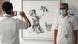 Healthcare workers photograph one another in front of the Banksy painting "Game Changer" at Southampton General Hospital in England Healthcare workers photograph one another in front of the Banksy painting "Game Changer" at Southampton General Hospital in England