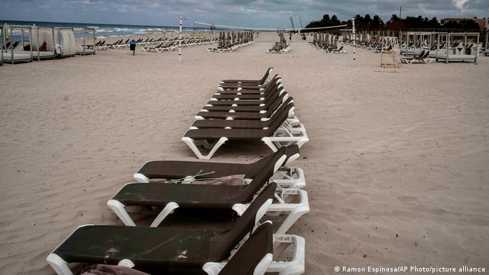 A beach in Cuba with empty lounge chairs